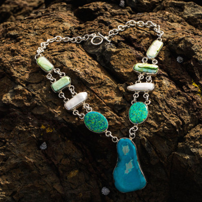 Sterling silver necklace with 6 mother of pearls, 2 green opals and a large turquoise.